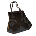 Large Black Patent Leather Handbag with Textured Leather Floral Design circa 1910s