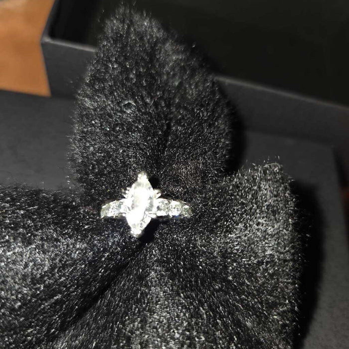 Marquise Cut Engagement Ring with Side Stones